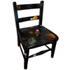 A small childs chair with outer space painted theme